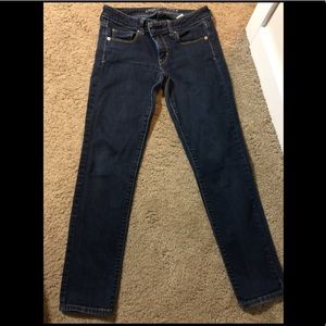 Super skinny stretch dark blue jeans.